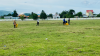 Quang cảnh các bạn tuổi trẻ huyện miền núi Vân Canh thu gom rác trên mặt sân vận động